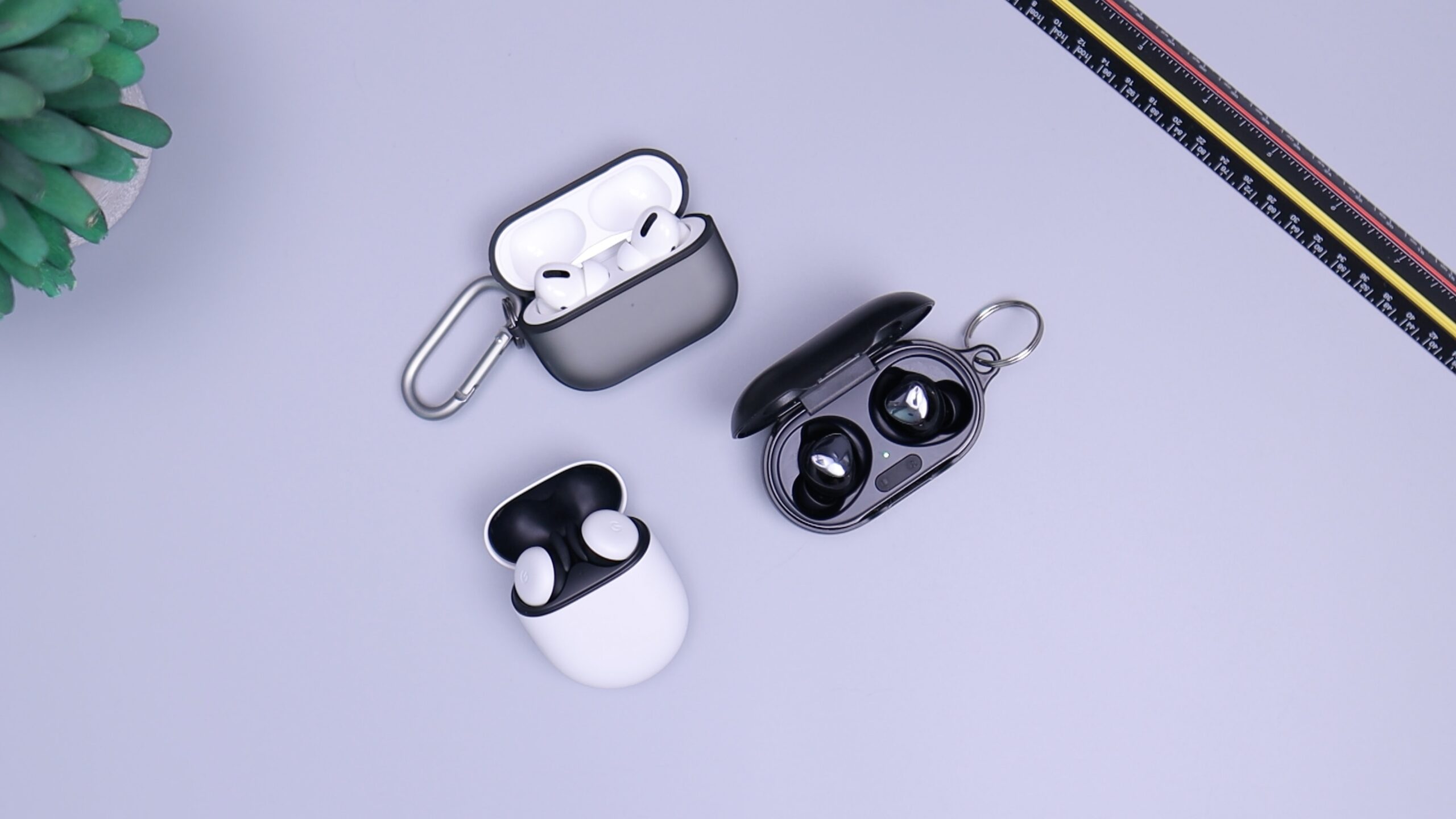 black and white earphone with smartphone gadget on white table